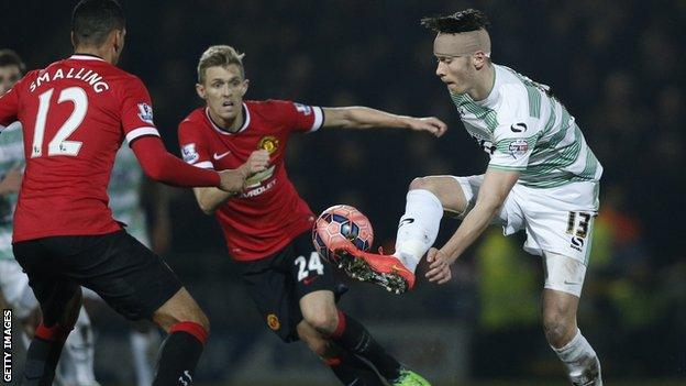 Kieffer Moore playing for Yeovil against Manchester United