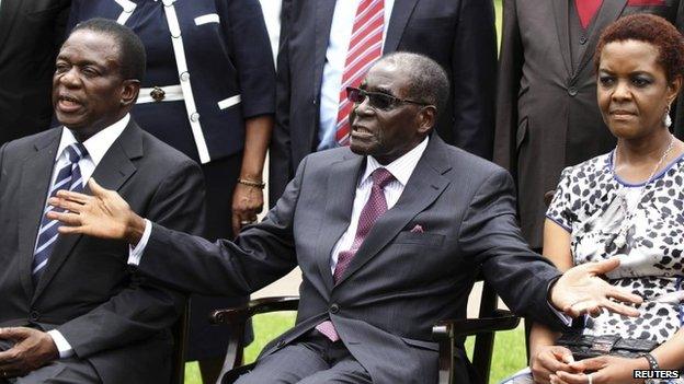 Zimbabwe's President Robert Mugabe (centre) sits with his wife Grace Mugabe and Emmerson Mnangagwa (left) - 12 December 2014