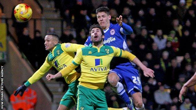 Cardiff's Alex Revell heads for goal against Norwich City