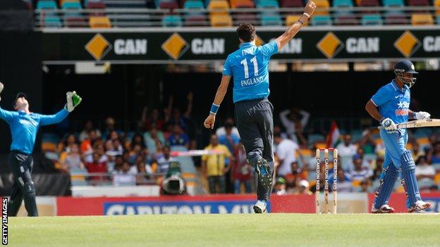 Steven Finn celebrates