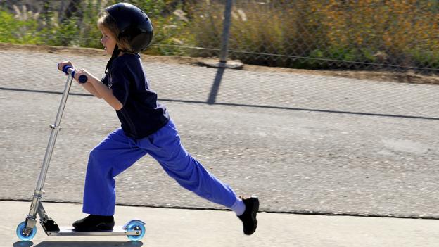 Child on scooter