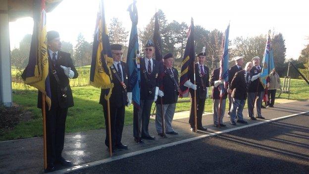 Standard bearers stood to attention to greet the hearse