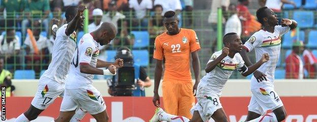 Guinea celebrate taking the lead with their first shot on target in the game