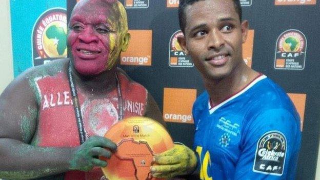 Cape Verde's Heldon is presented with the man-of-the-match award