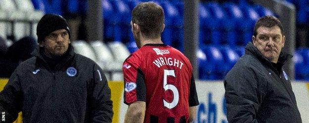 Frazer Wright leaves the field as Tommy Wright looks on