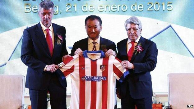 Atletico Madrid CEO Miguel Angel Gil, Wanda Group Chairman Wang Jianlin and Atletico Madrid President Enrique Cerezo