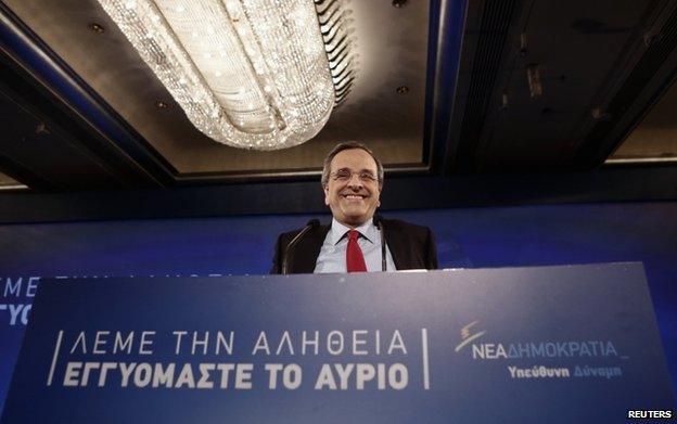 Greece's Prime Minister and leader of the ruling conservative New Democracy party Antonis Samaras smiles as he steps on the stage to deliver a pre-election speech outlining his policies in Athens 10 January 2015.