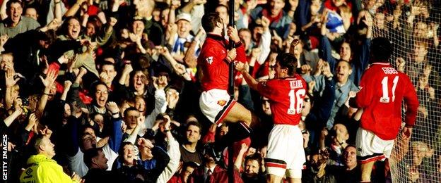 Eric Cantona celebrates scoring against Liverpool in his first game back from his ban