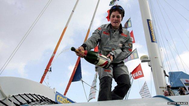 Ellen MacArthur celebrates after returning to Falmouth harbour in Cornwall in February 2005 after her record-breaking solo, non-stop, round-the-world voyage