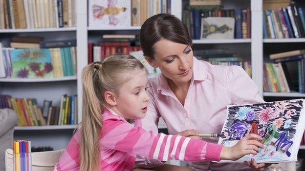 Woman helping a child