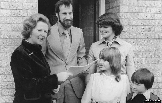 Margaret Thatcher hands over the deeds to the council house belonging to the King family of Milton Keynes, Buckinghamshire, 25th September 1979.