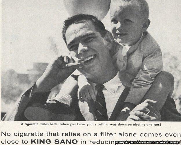 Man smoking with a baby on his shoulders