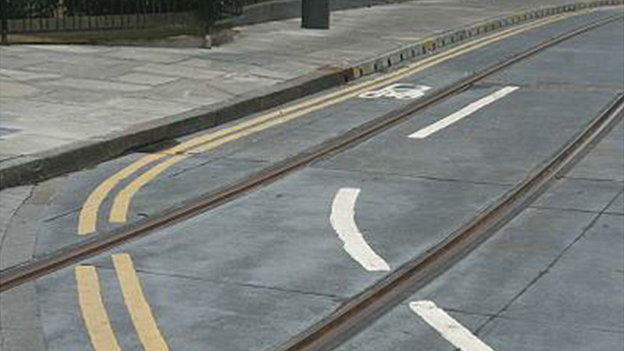 The cycle lane at Haymarket Yards with a tram line going straight through it