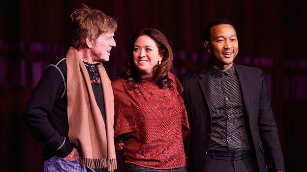 John Legend (right) with Robert Redford and director Liz Garbus