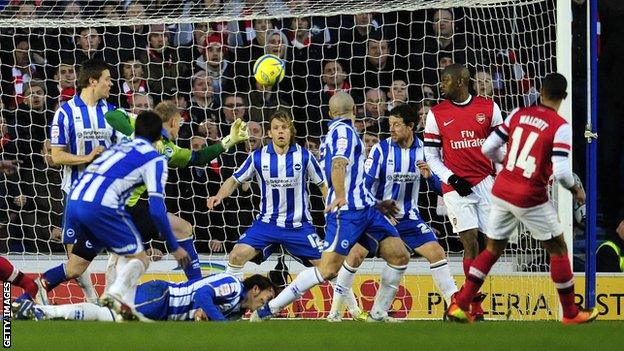 Theo Walcott scores Arsenal's winning goal as the Gunners beat Brighton 3-2 in January 2013