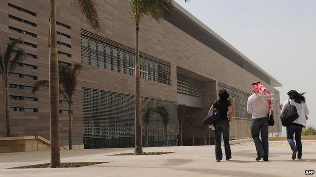 File photo: A man walks with two unveiled women at the campus of the King Abdullah University of Science and Technology (KAUST) in Thuwal, 80 kilometers north of Jeddah, 13 October 2009