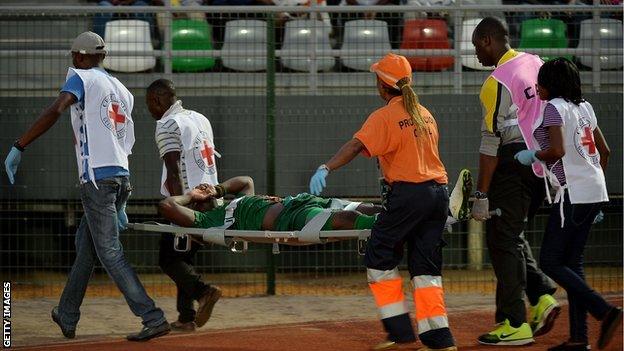 Zambia striker Emmanuel Mayuka leaves the stadium on a stretcher