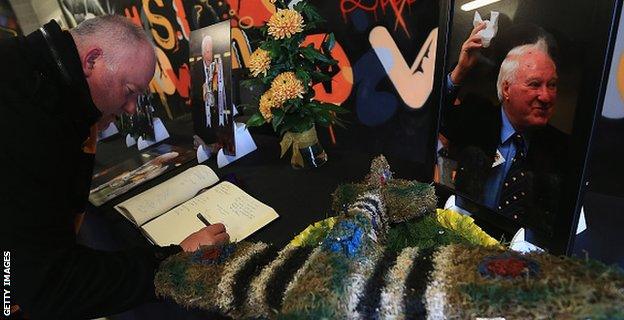 Wolves fans signing a book of condolence for former owner Sir Jack Hayward, who died earlier this month