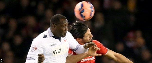 Bolton's Emile Heskey (left) and Liverpool's Emre Can