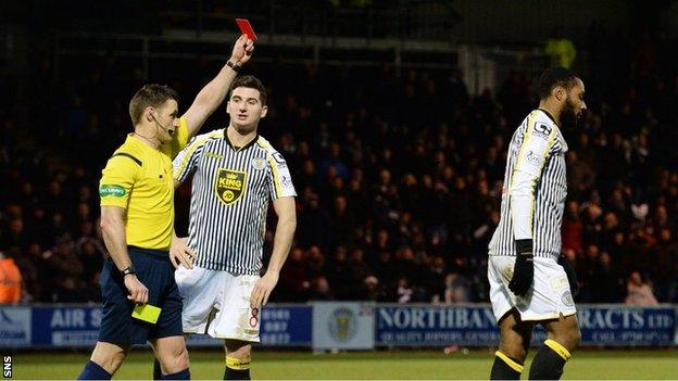 Referee Steven McLean shows the red card to Yoann Arquin