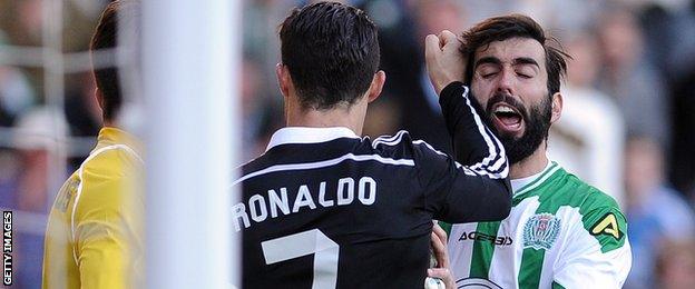 Ronaldo tussles with Jose Angel Crespo, who he appeared to punch earlier in the game