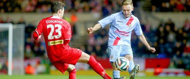 Cliftonville midfielder Tomas Cosgrove challenges Sky Blues defender Stephen McBride