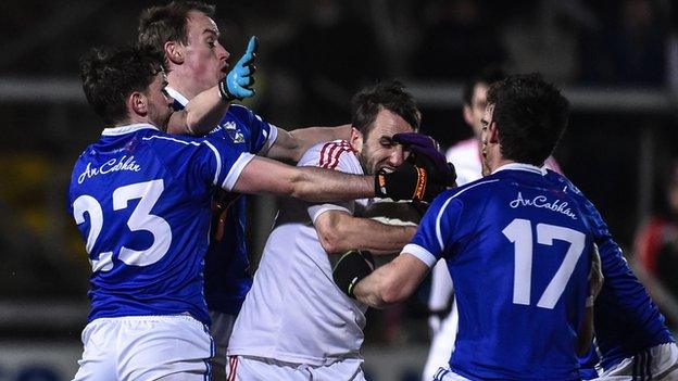 Cavan players surround Tyrone's Mark Donnelly in the Athletic Grounds final