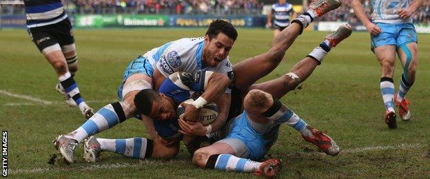 Sean Maitland and Finn Russell stop Anthony Watson from scoring a try