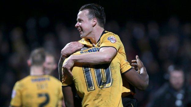 Josh Coulson celebrates Cambridge United's 0-0 draw against Manchester United