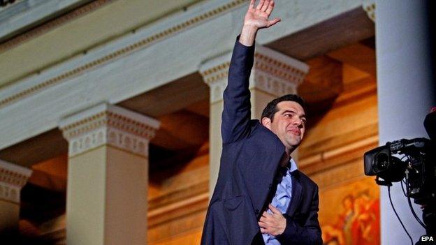 Alexis Tsipras, opposition leader and head of radical leftist Syriza party, greets supporters after the initial election results for the Greece general elections in Athens, Greece, 25 January 2015