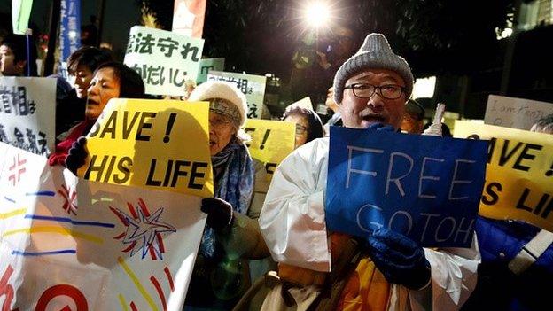 About 200 demonstrators call on Prime Minister Shinzo Abe to secure the release of freelance journalist Kenji Goto from the Islamic State in front of the Abe's official residence on January 25, 2015 in Tokyo, Japan.