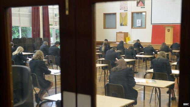 Teenagers at a secondary school sitting exams