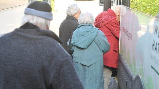 Elderly people leaving the Douglas Tilbe House day centre in Welwyn Garden Centre, Hertfordshire