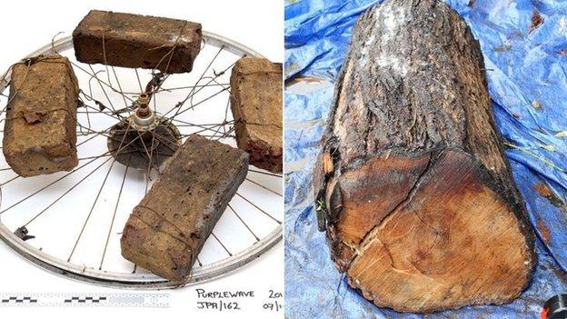 Wheel, bricks and log