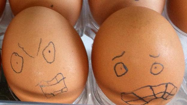 Eggs with faces drawn on them