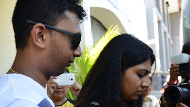 Chinthu Sukumaran (R) and Brintha Sukumaran (L) visit their brother Myuran Sukumaran inside Kerobokan prison in Denpasar on Bali island on 26 January 2015.