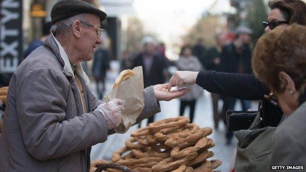 Street vendors sell bread from a stall in Athens on 26 January 2015