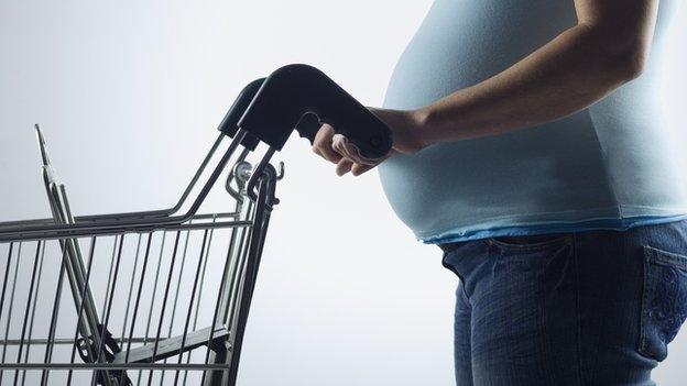 woman with supermarket trolley