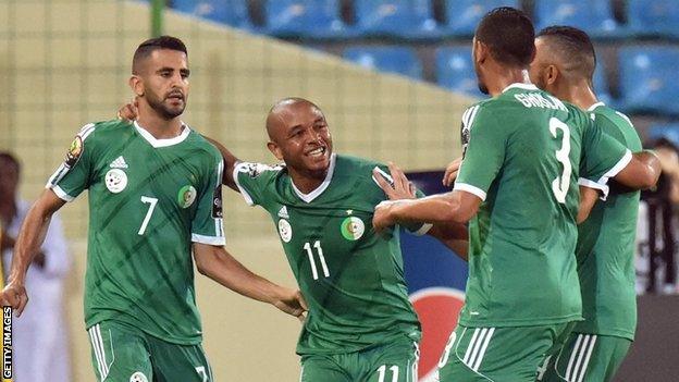 Riyad Mahrez (left) is congratulated after scoring for Algeria