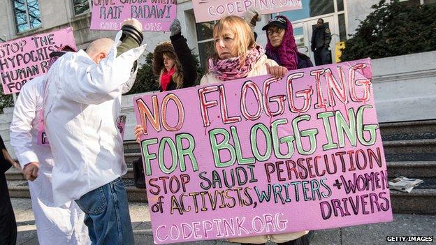 Protesters in Washington hold signs