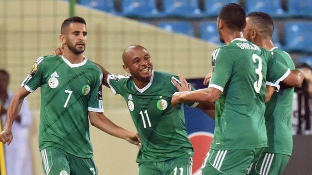 Riyad Mahrez (left) is congratulated after scoring for Algeria