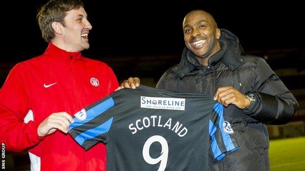 Jason Scotland shares a joke with player-manager Martin Canning