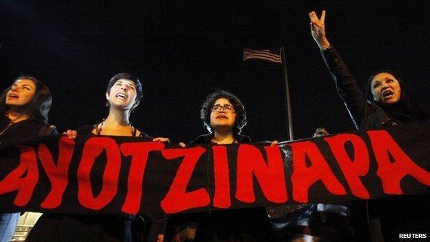 Women hold banner and yell slogans in support of the 43 missing trainee teachers of the Ayotzinapa teachers" training college, during a protest at the International Santa Fe bridge and border crossing between Mexico and the U.S. in Ciudad Juarez 26 Jan 2015