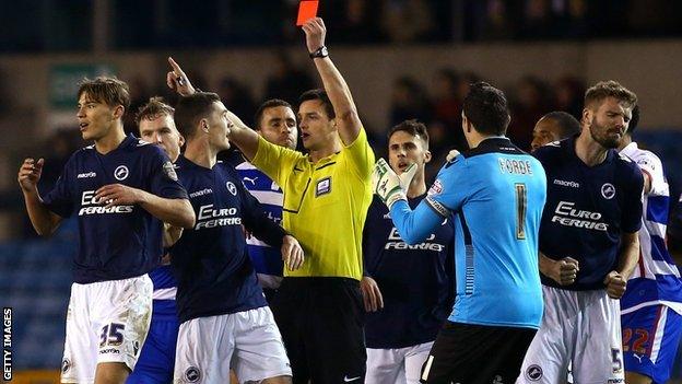 Millwall's Sid Nelson is shown a red card