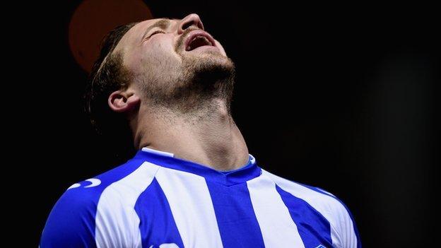 Chris Maguire of Sheffield Wednesday looks dejected