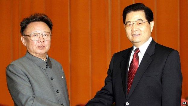 In this photo released by China's Xinhua new agency, Chinese President Hu Jintao, right, shakes hands with North Korean leader Kim Jong-il, left, at Beijing's Great Hall of the People on 17 January 2006