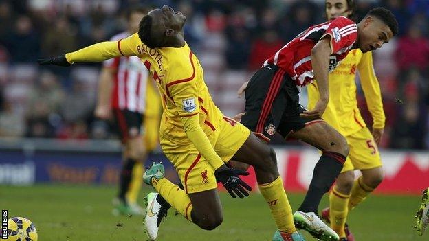 Mikael Mandron tangles with Mario Balotelli in Sunderland's 1-0 home defeat by Liverpool