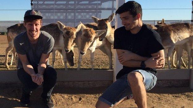 Matt and Ben pose for a photo with the deer at Rooster Cogburn's Ostrich Ranch