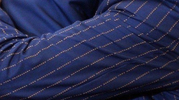 A close up of the suit pattern