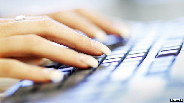 Hands on a computer keyboard